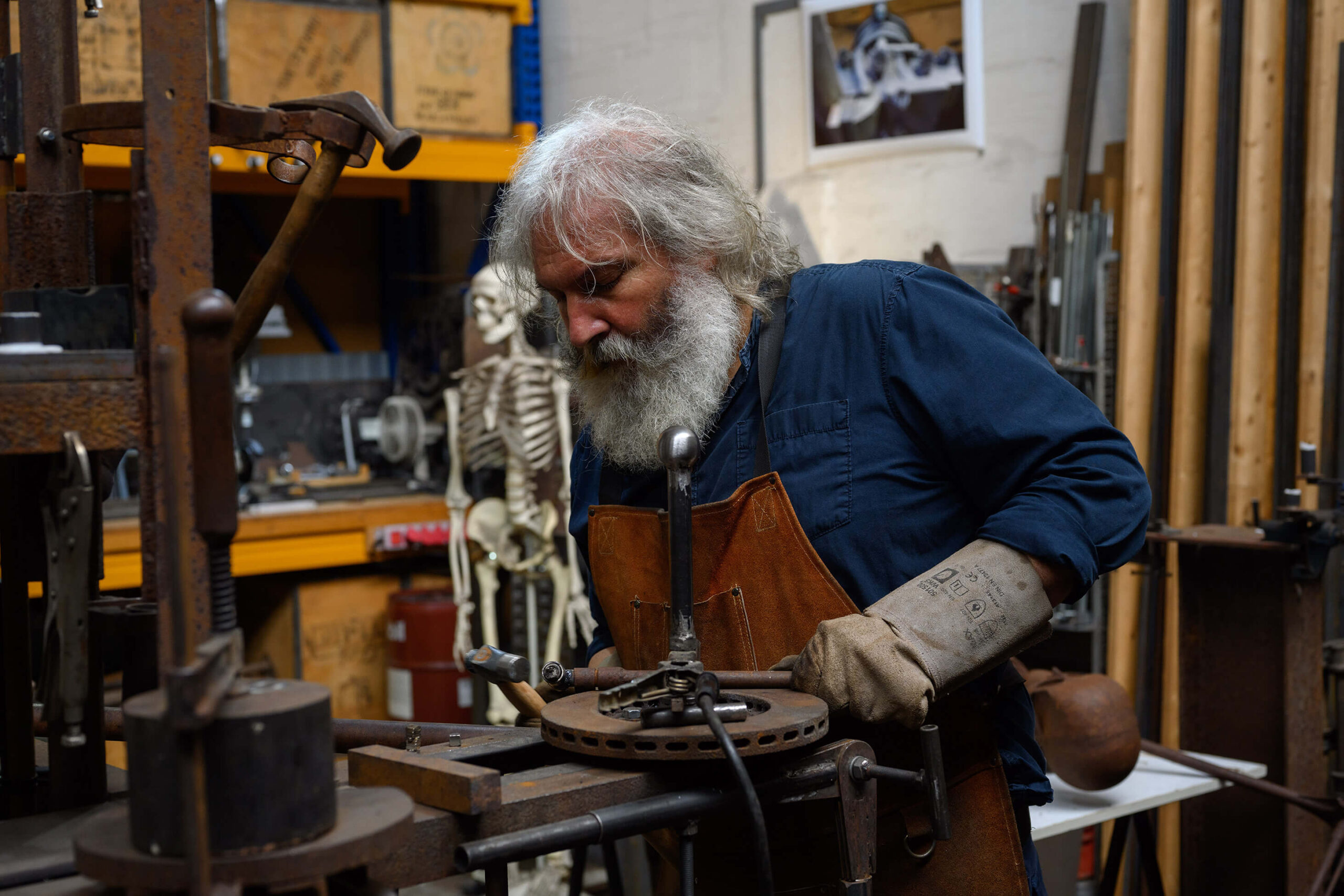 Portrait of sculptor Wolfgang Oude Hengel at work in his studio in Mönchengladbach, Germany.