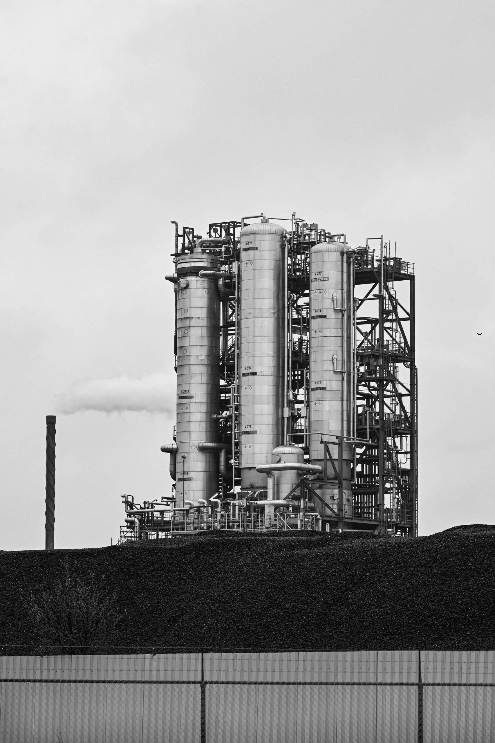 Refinery and smoking chimney in black and white in Maasvlakte 2 Rotterdam's newest port intended to become the most sustainable and innovative port in the world.