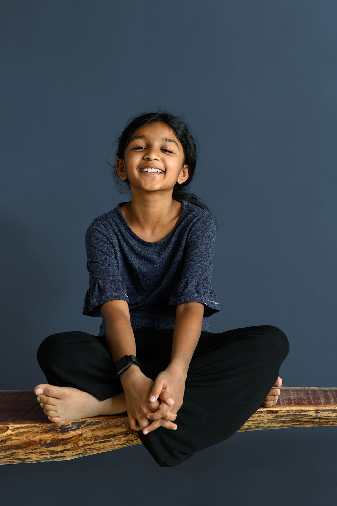 Young girl in meditation pose in India