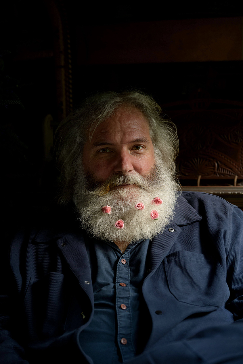 Wolfgang Oude Hengel, sculptor portrait with flowers in Mönchengladbach, Germany.